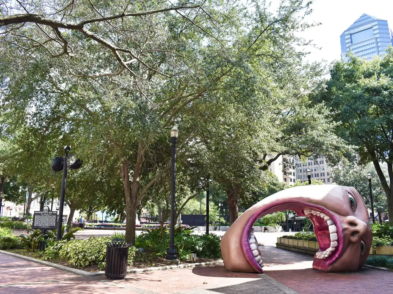 Shade trees and public art in James Weldon Johnson Park on West Monroe Street, downtown Jacksonville's central square.