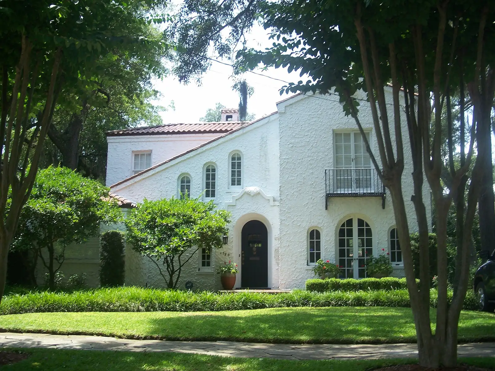 A stucco house on a tree-lined street in the Avondale Historic District of Jacksonville.