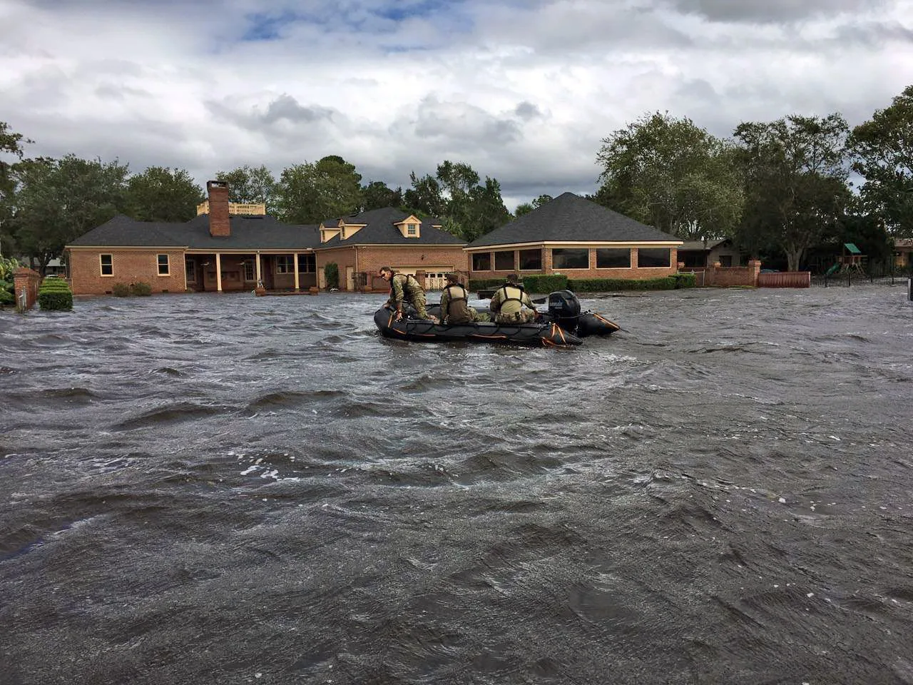 Florida National Guard soldiers go door to door by boat in the flooded Ortega neighborhood of Jacksonville after Hurricane Irma.