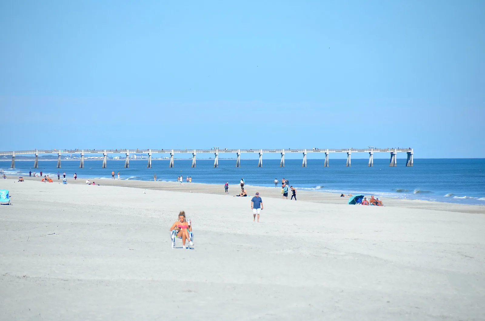 Beachgoers near the fishing pier in Jacksonville Beach, on the Atlantic coast of Duval County.