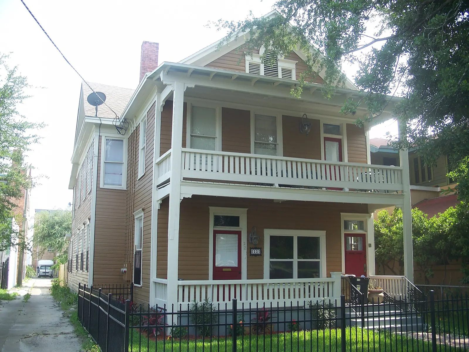 A two-story frame house with a double front porch in the Springfield Historic District, north of downtown Jacksonville