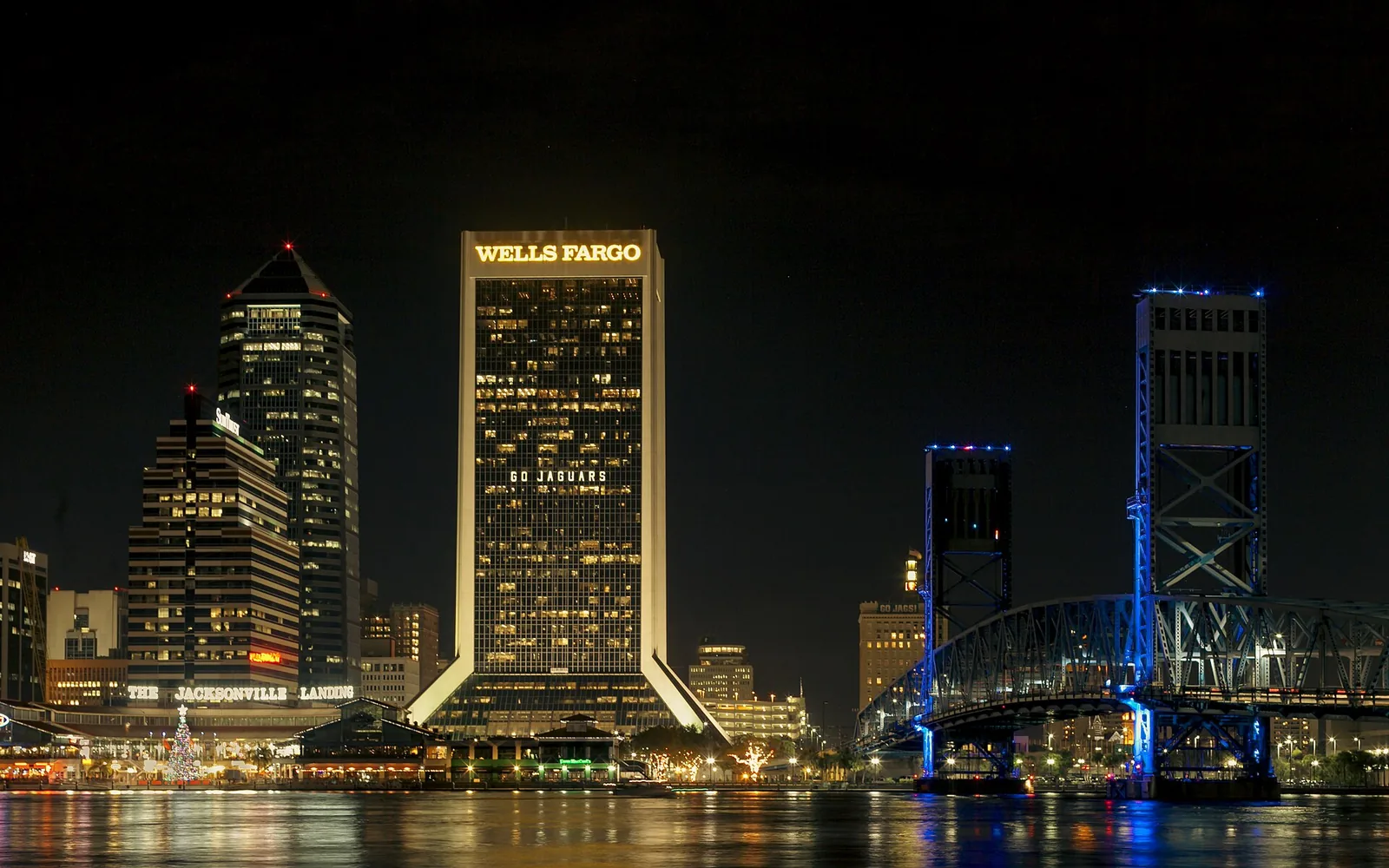 Downtown Jacksonville and the Main Street Bridge lit up at night, seen across the St. Johns River
