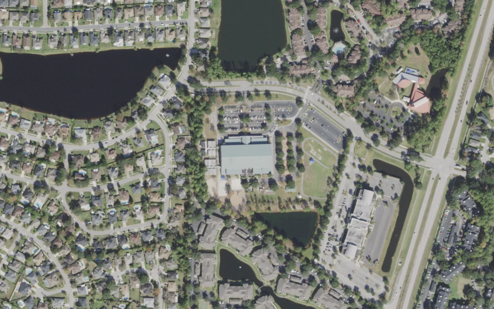 Chets Creek Elementary's campus (center) and the blocks around it on Chets Creek Boulevard in Jacksonville, seen from the air