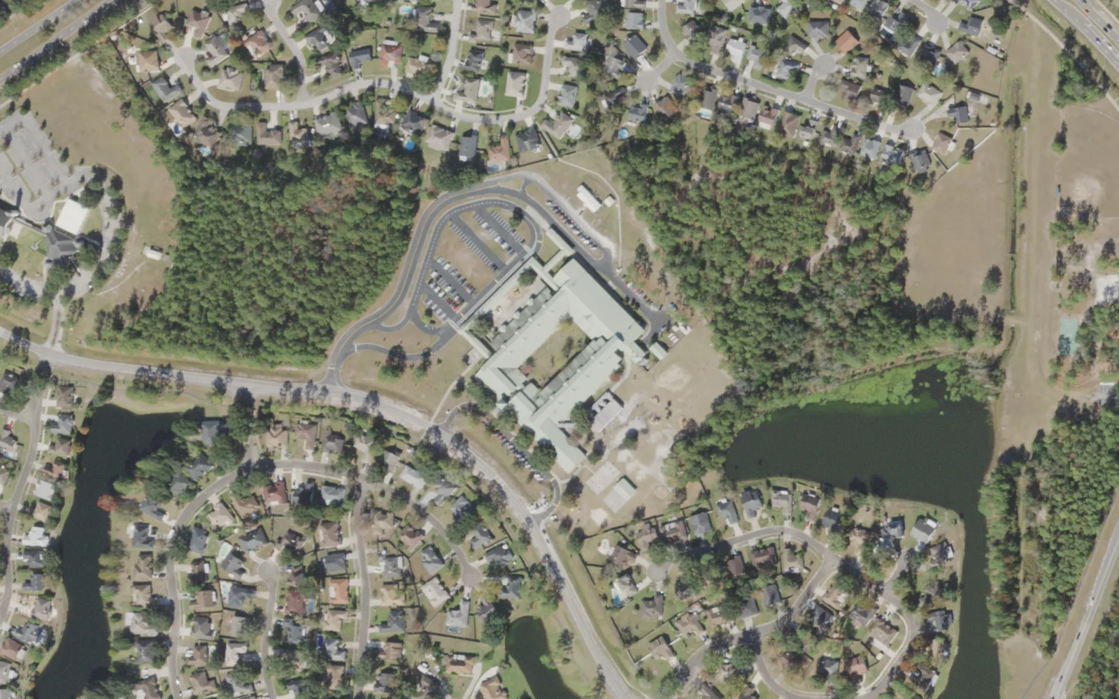 Chimney Lakes Elementary's campus (center) and the blocks around it on Staples Mill Drive in Jacksonville, seen from the air