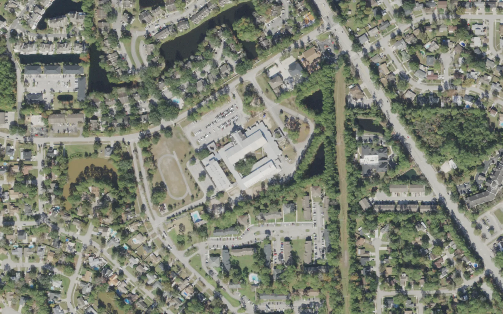 Crown Point Elementary's campus (center) and the blocks around it on Crown Point Road in Jacksonville, seen from the air