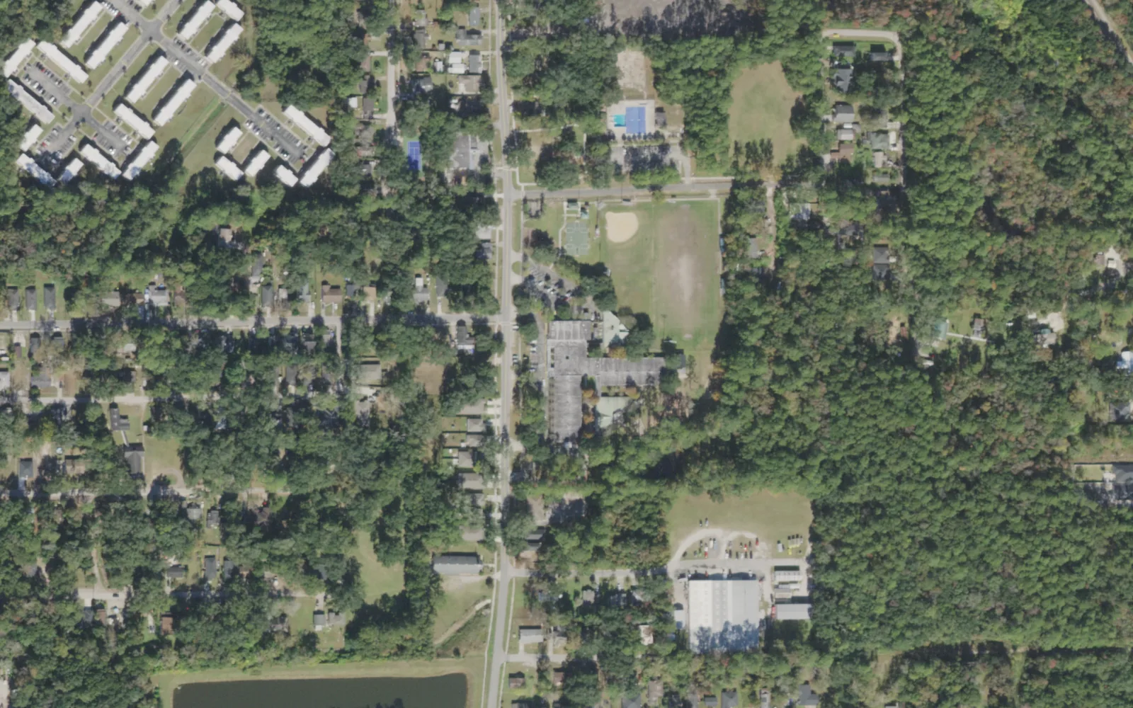Pine Forest Elementary's campus (center) and the blocks around it on Grant Road in Jacksonville, seen from the air