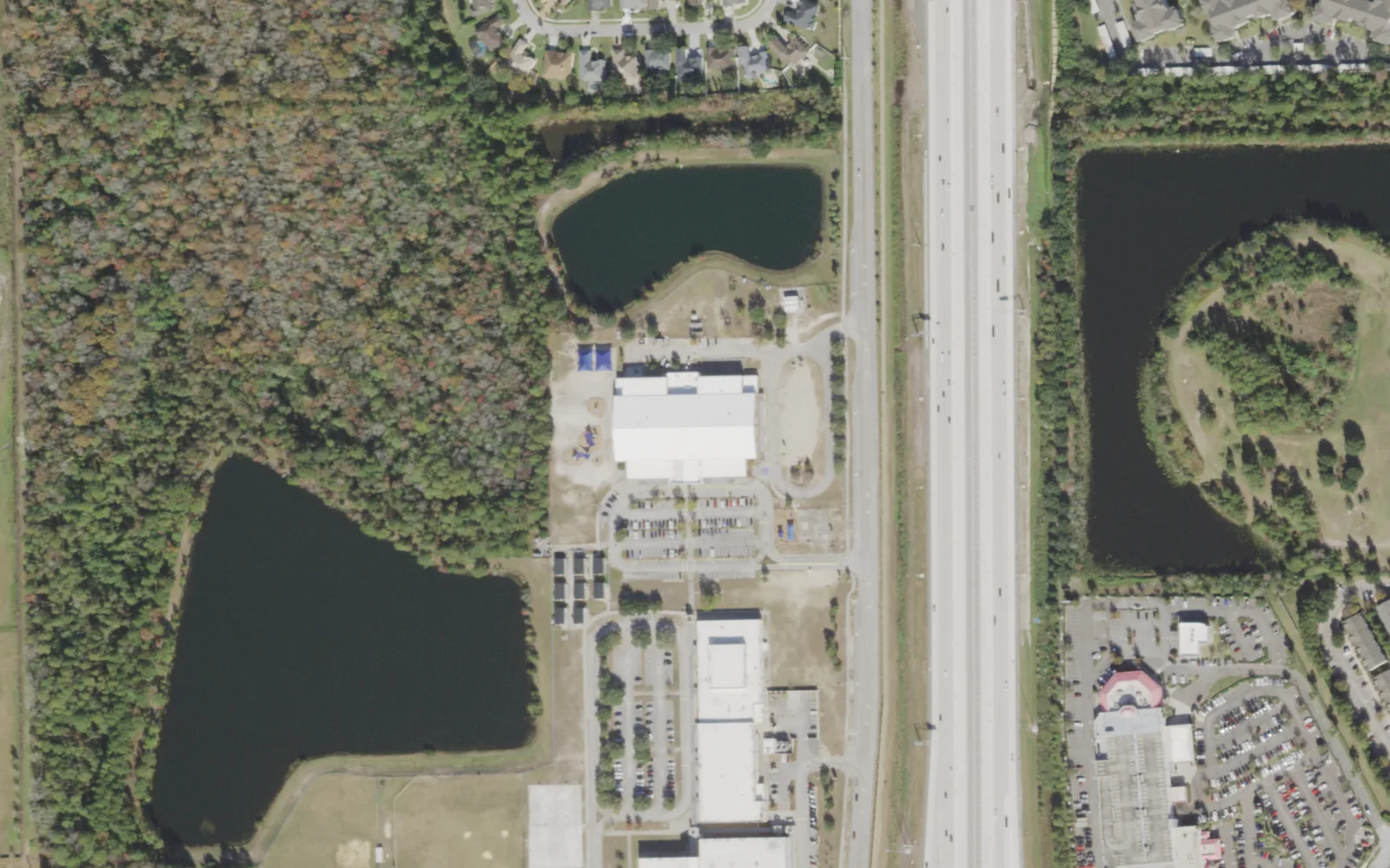 Twin Lakes Academy Elementary's campus (center) and the blocks around it on Point Meadows Drive in Jacksonville, seen from the air