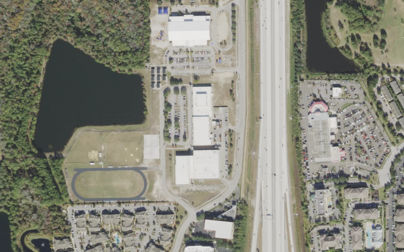Twin Lakes Academy Middle's campus (center) and the blocks around it on Point Meadows Drive in Jacksonville, seen from the air