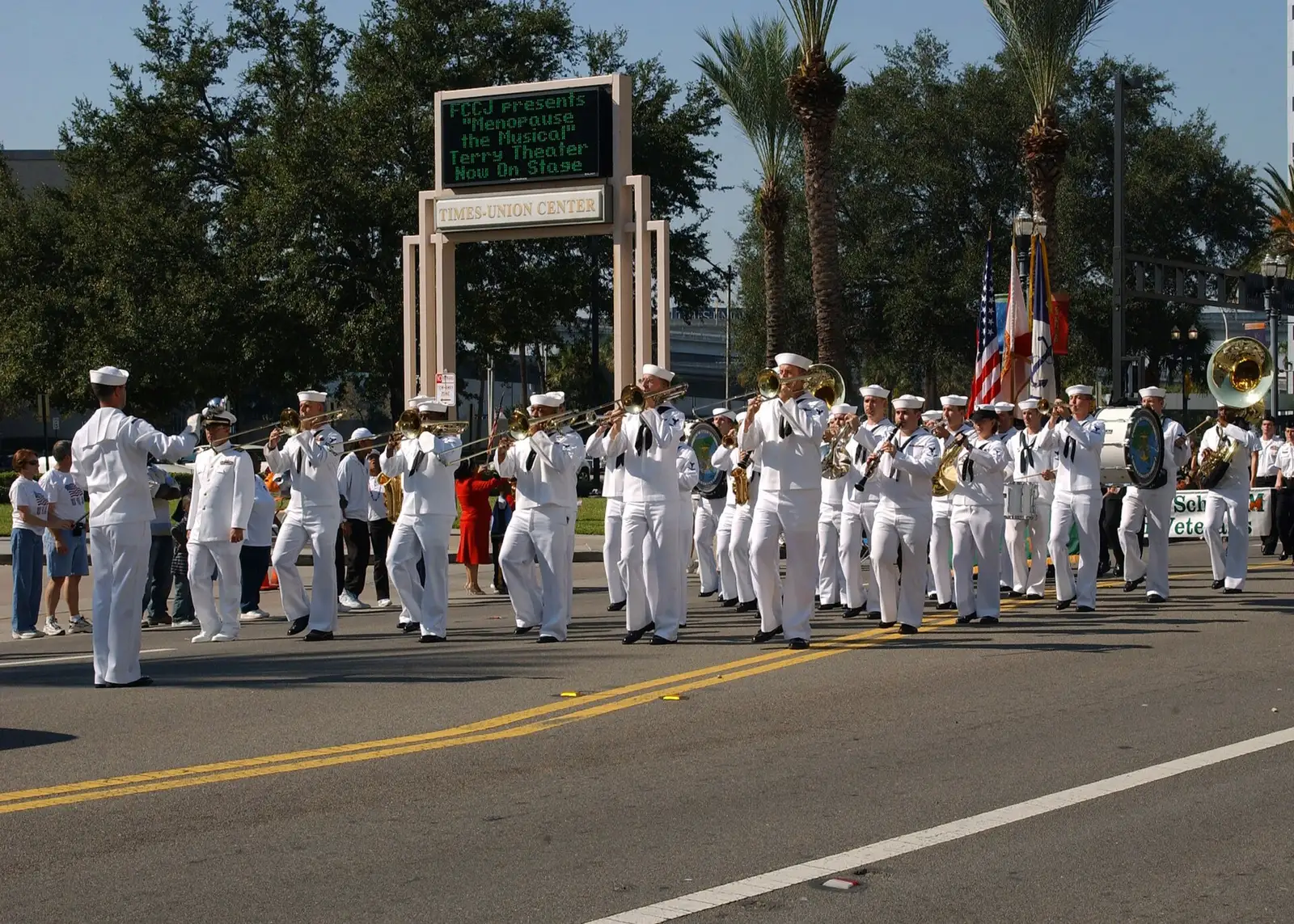 The Navy Band Southeast marching band plays on Water Street outside the Times-Union Center during Jacksonville's Veterans Day Parade.